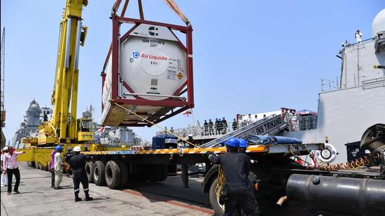 Navy personnel unload Liquid Medical Oxygen tanks supplied by French company Air Liquide as part of France's assistance efforts toward Covid-19 relief to India after arriving from Qatar, at the naval dockyard in Mumbai on May 10. (File photo)