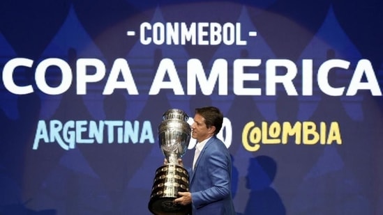 Brazilian former player Juninho Paulista carries the Copa America trophy. File (AP) Brazilian former player Juninho Paulista carries the Copa America trophy. File (AP)