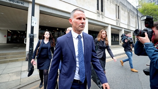 Former Manchester United footballer Ryan Giggs leaves Manchester Crown Court where he appeared on charges of assaulting two women, in Manchester.(AP) Former Manchester United footballer Ryan Giggs leaves Manchester Crown Court where he appeared on charges of assaulting two women, in Manchester.(AP)