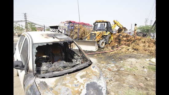 The confiscated vehicles that were damaged after a fire broke out in front of Basti Jodhewal police station in Ludhiana on Monday. (Gurpreet Singh/HT)