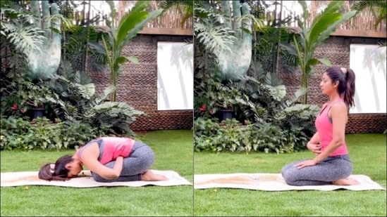 Female Doing Yoga Poses On Sunny Morning In The Green Garden Stock