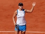 Australia's Ashleigh Barty celebrates after winning her first-round match against Bernarda Pera of the U.S.