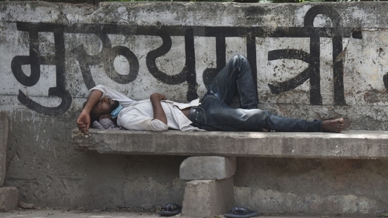 Arjun, a 27-year-old daily wage worker resting by the roadside while looking for employment at Mayur Vihar in New Delhi on Monday, May 31, 2021. (Photo by Raj K Raj / Hindustan Times) Arjun, a 27-year-old daily wage worker resting by the roadside while looking for employment at Mayur Vihar in New Delhi on Monday, May 31, 2021. (Photo by Raj K Raj / Hindustan Times)