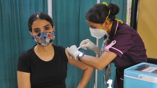 Residents taking a dose of Covid-19 vaccine at a private vaccine center in New Public School Sector 18 in Chandigarh. (Keshav Singh/Hindustan Times)