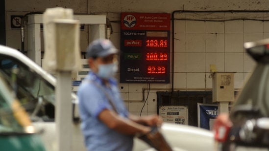 An attendant at a petrol pump, with fuel rates displayed behind him on a digital screen as petrol price reached new highs in Mumbai in this file picture from Saturday. (Vijay Bate/HT Photo) An attendant at a petrol pump, with fuel rates displayed behind him on a digital screen as petrol price reached new highs in Mumbai in this file picture from Saturday. (Vijay Bate/HT Photo)