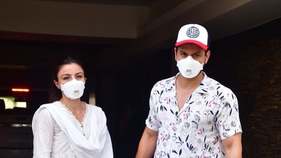 Soha Ali Khan with Kunal Kemmu in Bandra. She was seen in a white suit and him in a white printed shirt.
