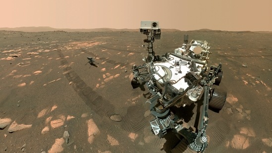Image made available by Nasa shows the Perseverance Mars rover, foreground, and the Ingenuity helicopter about 13 feet (3.9 meters) behind. This composite image was made by the WASTON camera on the rover's robotic arm on the 46th Martian day, or sol, of the mission.(NASA/JPL-Caltech/MSSS)