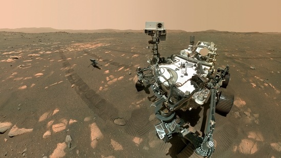 Image made available by Nasa shows the Perseverance Mars rover, foreground, and the Ingenuity helicopter about 13 feet (3.9 meters) behind. This composite image was made by the WASTON camera on the rover's robotic arm on the 46th Martian day, or sol, of the mission.(NASA/JPL-Caltech/MSSS)