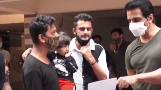 Sonu Sood interacts with a person.
