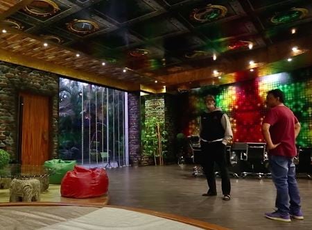 Ram Gopal Varma gives Amitabh Bachchan a tour of his office.