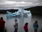 In this file photo taken on July 03, 2019 tourists watch an iceberg float near King's Point in Newfoundland, Canada. (AFP )