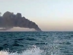 Gulf of Oman: This image shows smoke rising from Iran's navy support ship Kharg in the Gulf of Oman. Kharg, Iran's largest warship.(AP) Gulf of Oman: This image shows smoke rising from Iran's navy support ship Kharg in the Gulf of Oman. Kharg, Iran's largest warship.(AP)