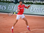 Novak Djokovic in action. Novak Djokovic in action.
