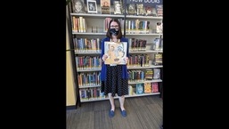 In this photo provided by Heights Libraries, Sara Phillips, a branch manager with Heights Libraries in Ohio, holds the Bob Dylan double album "Self Portrait" borrowed in 1973 by eighth-grader Howard Simon he returned recently 48 years overdue. In this photo provided by Heights Libraries, Sara Phillips, a branch manager with Heights Libraries in Ohio, holds the Bob Dylan double album "Self Portrait" borrowed in 1973 by eighth-grader Howard Simon he returned recently 48 years overdue.