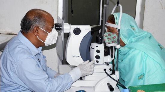 A doctor checking the eye of a patient infected with black fungus. (ANI)