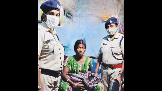 RPF women team members with the mother and her child in Ludhiana on Wednesday. (HT PHOTO)