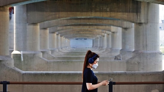 A woman takes a walk at a Han river park , in Seoul, South Korea. (REUTERS) A woman takes a walk at a Han river park , in Seoul, South Korea. (REUTERS)