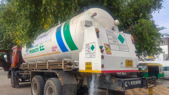 Oxygen-filled tankers stand parked at the Old Faridabad Railway Station, in Faridabad. (PTI)