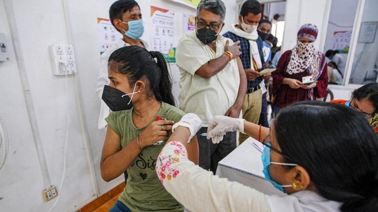 A healthcare worker administers a dose of Covid-19 vaccine to a girl, at a hospital in Prayagraj, on Wednesday. (PTI Photo) A healthcare worker administers a dose of Covid-19 vaccine to a girl, at a hospital in Prayagraj, on Wednesday. (PTI Photo)