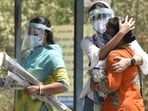 Relatives mourn death of a loved one at a crematorium in Delhi. Relatives mourn death of a loved one at a crematorium in Delhi.