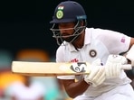 India's batsman Cheteshwar Pujara plays a shot on day five of the fourth cricket Test match between Australia and India at The Gabba in Brisbane. (AFP) India's batsman Cheteshwar Pujara plays a shot on day five of the fourth cricket Test match between Australia and India at The Gabba in Brisbane. (AFP)