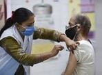 A health worker gives a dose of COVID-19 vaccine to a senior citizen at a vaccination centre in New Delhi. A health worker gives a dose of COVID-19 vaccine to a senior citizen at a vaccination centre in New Delhi.
