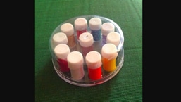 The image shows a multi-coloured liquid bindi pack.