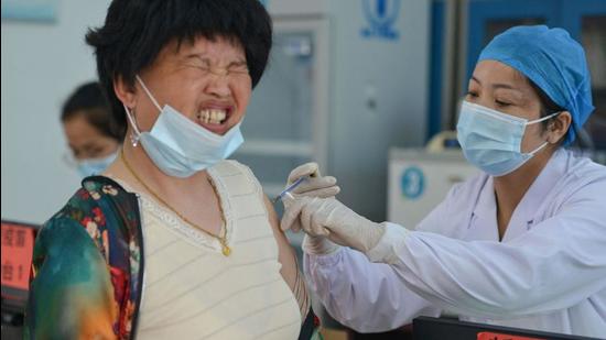 A resident receives coronavirus vaccine in Linquan county, Fuyang city, in China's eastern Anhui province. (AFP)