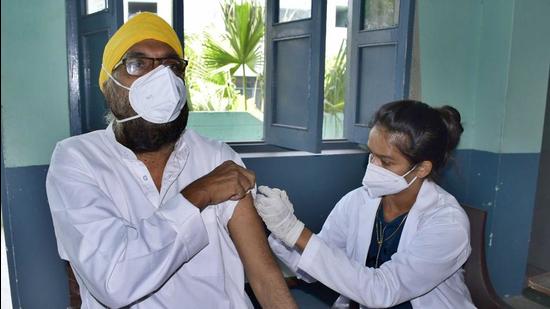 A man being administered the Covid vaccine at Sargodha Public Senior Secondary School, Field Ganj, Ludhiana, on Thursday. (Harsimar Pal Singh) A man being administered the Covid vaccine at Sargodha Public Senior Secondary School, Field Ganj, Ludhiana, on Thursday. (Harsimar Pal Singh)