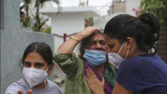 The mother of Rakesh Pandita, a politician who was killed late on Wednesday, mourns at their residence in Jammu on Thursday. (AP) The mother of Rakesh Pandita, a politician who was killed late on Wednesday, mourns at their residence in Jammu on Thursday. (AP)