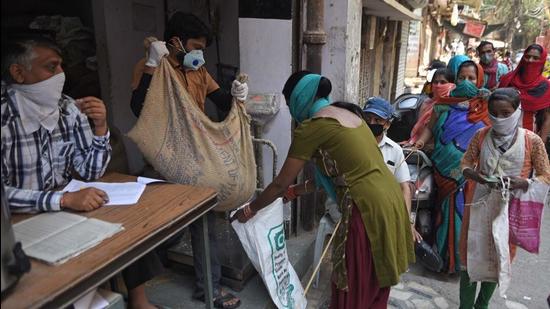 People queue up to take foodgrains from a government PDS shop in New Delhi. (HT file) People queue up to take foodgrains from a government PDS shop in New Delhi. (HT file)