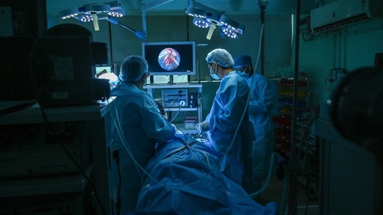 ENT specialist Dr. Brajpal Singh Tyagi (L) performs surgery to remove black fungus (Mucormycosis) from a patient who recovered from the Covid-19 coronavirus at a hospital in Ghaziabad on June 1, 2021. (Photo by Prakash SINGH / AFP) ENT specialist Dr. Brajpal Singh Tyagi (L) performs surgery to remove black fungus (Mucormycosis) from a patient who recovered from the Covid-19 coronavirus at a hospital in Ghaziabad on June 1, 2021. (Photo by Prakash SINGH / AFP)