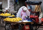 A fruit vendor waits for customers at a street in New Delhi(AFP) A fruit vendor waits for customers at a street in New Delhi(AFP)