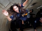 Researcher for the International Institute for Astronautical Sciences (IIAS), Kellie Gerardi, experiances weightlessness on a Zero Gravity plane.
