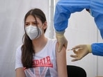 A girl gets a Pfizer BioNTech Covid-19 vaccine in Bucharest, Romania.(AP) A girl gets a Pfizer BioNTech Covid-19 vaccine in Bucharest, Romania.(AP)
