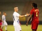Greece's Dimitris Pelkas, center, shakes hands with Belgium's Dedryck Boyata.(AP) Greece's Dimitris Pelkas, center, shakes hands with Belgium's Dedryck Boyata.(AP)