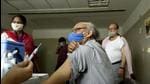 An elderly man gets vaccinated against Covid-19 at sector 30 district hospital, in Noida, Uttar Pradesh. (HT file)