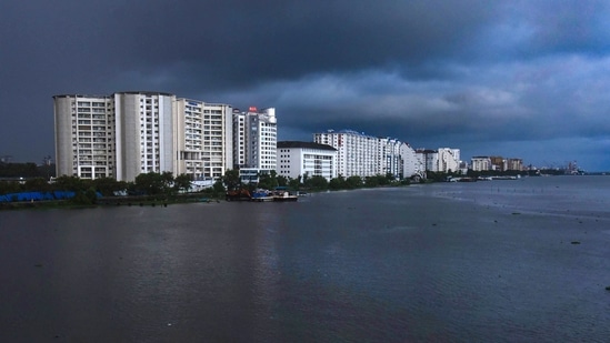 Dark clouds hover over skyscrapers in Kochi, on June 3. The arrival of monsoon, crucial to the country’s farm-dependent economy, is announced based on factors such as wind speed, consistency of rainfall, intensity, and cloud cover, HT reported. (PTI) Dark clouds hover over skyscrapers in Kochi, on June 3. The arrival of monsoon, crucial to the country’s farm-dependent economy, is announced based on factors such as wind speed, consistency of rainfall, intensity, and cloud cover, HT reported. (PTI)