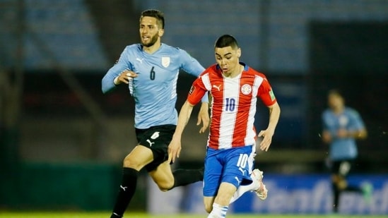 Paraguay's Miguel Almiron in action with Uruguay's Rodrigo Bentancur.(POOL via REUTERS)