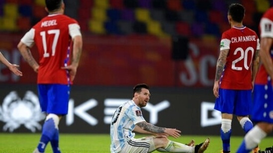 Argentina's Lionel Messi sits on the field during a qualifying football match against Chile.(AP)