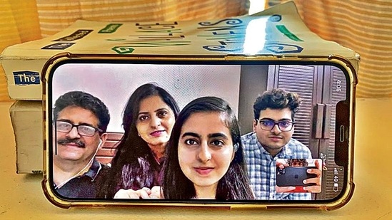 Posing for a portrait with her parents, Rajeev and Neeru, and younger brother, Rachit, she agrees to share the poem with us. (Mayank Austen Soofi) Posing for a portrait with her parents, Rajeev and Neeru, and younger brother, Rachit, she agrees to share the poem with us. (Mayank Austen Soofi)