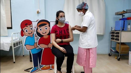 A woman receives a dose of Covid-19 vaccine in Mumbai, India. (REUTERS) A woman receives a dose of Covid-19 vaccine in Mumbai, India. (REUTERS)
