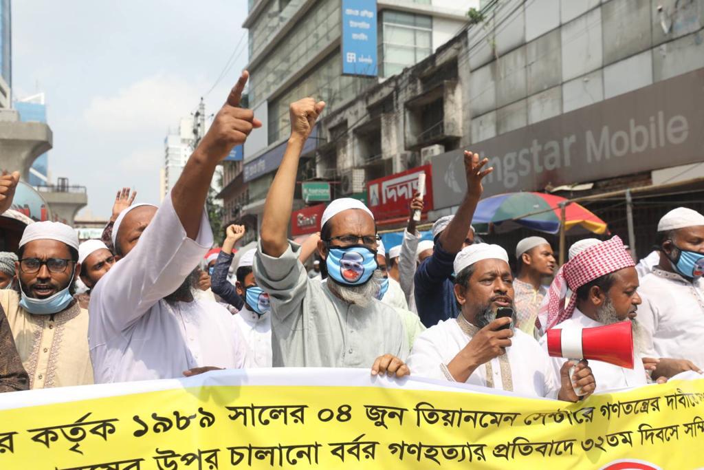 People in Bangladesh holding demonstrations against China's human rights violations.