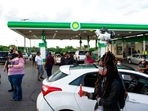 People gather for a vigil at the BP gas station in Kansas City, Missouri, Wednesday where Malcolm Johnson was shot and killed by police.(AP) People gather for a vigil at the BP gas station in Kansas City, Missouri, Wednesday where Malcolm Johnson was shot and killed by police.(AP)