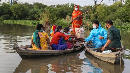 A volunteer distributes masks, sanitizers and food among people at Yamuna Khadar in New Delhi on June 2. The national capital has been under lockdown since April 19 in view of the massive surge in Covid-19 cases in the second wave of the pandemic. (PTI) A volunteer distributes masks, sanitizers and food among people at Yamuna Khadar in New Delhi on June 2. The national capital has been under lockdown since April 19 in view of the massive surge in Covid-19 cases in the second wave of the pandemic. (PTI)