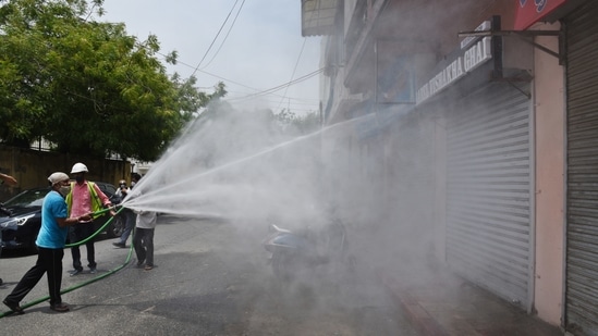 Municipal workers sanitizing an area at Dev Nagar in Karol Bagh, New Delhi on June 1. The chief minister also announced further steps being taken such as buffer stocks of potential medicines being worked on as part of preparations. Two genome sequencing laboratories will also be set up for the detection of new variants. (Ajay Aggarwal / HT Photo) Municipal workers sanitizing an area at Dev Nagar in Karol Bagh, New Delhi on June 1. The chief minister also announced further steps being taken such as buffer stocks of potential medicines being worked on as part of preparations. Two genome sequencing laboratories will also be set up for the detection of new variants. (Ajay Aggarwal / HT Photo)