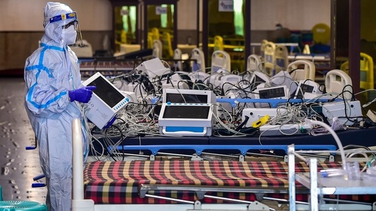 A worker arranges monitors after Covid patients were discharged at Shehnai Banquet Hall, converted into a Covid-19 isolation centre in New Delhi on June 3. On preparation against potential third wave, the chief minister said that arrangements are being made with a peak of 37,000 cases in mind. A storage capacity of 420 tonnes of oxygen is being created. (Manvender Vashisht / PTI) A worker arranges monitors after Covid patients were discharged at Shehnai Banquet Hall, converted into a Covid-19 isolation centre in New Delhi on June 3. On preparation against potential third wave, the chief minister said that arrangements are being made with a peak of 37,000 cases in mind. A storage capacity of 420 tonnes of oxygen is being created. (Manvender Vashisht / PTI)