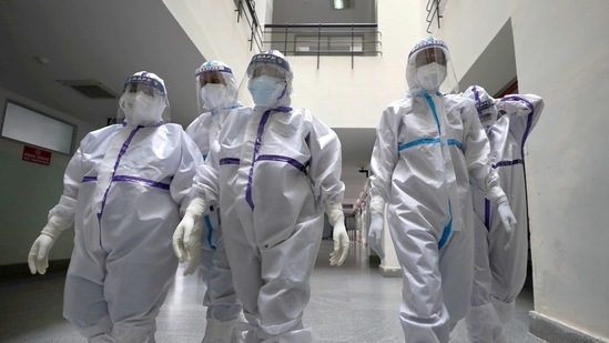 Bengaluru: Nurses head for a week-long duty inside Covid-19 wards, at Ramaiah Medical College Hospital in Bengaluru, on Friday, June 4, 2021. (PTI Photo) Bengaluru: Nurses head for a week-long duty inside Covid-19 wards, at Ramaiah Medical College Hospital in Bengaluru, on Friday, June 4, 2021. (PTI Photo)