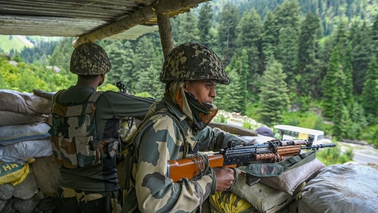 Border Security Force (BSF) personnel stand guard along the Srinagar-Leh National highway, in Ganderbal district of Central Kashmir. (PTI Photo) Border Security Force (BSF) personnel stand guard along the Srinagar-Leh National highway, in Ganderbal district of Central Kashmir. (PTI Photo)