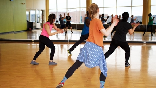 Zumba: On days when you do not feel like working out, just put on your workout clothes, play some fun music and practise Zumba. It helps improve cardiovascular fitness, lowers cholesterol and blood sugar levels.(Unsplash)
